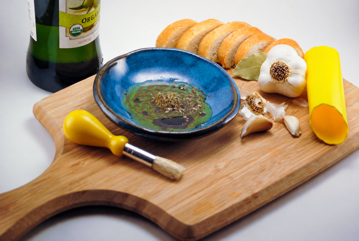 Olive oil dip served from a ceramic grater